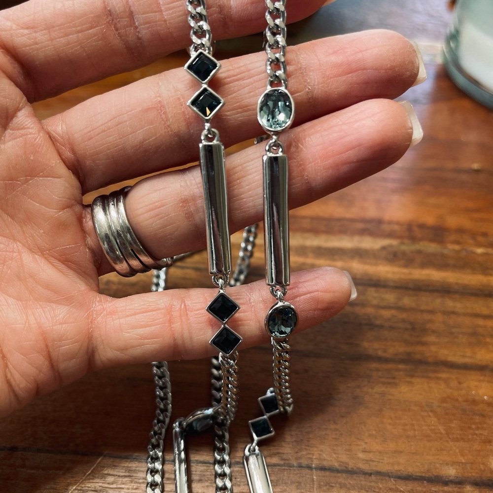 Beautiful Givenchy long necklace. Silver with aqua crystals.